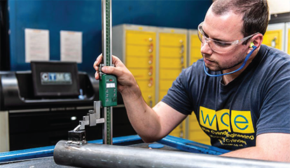An employee at Wye Cylinder Engineering manufacturing hydraulic cylinders